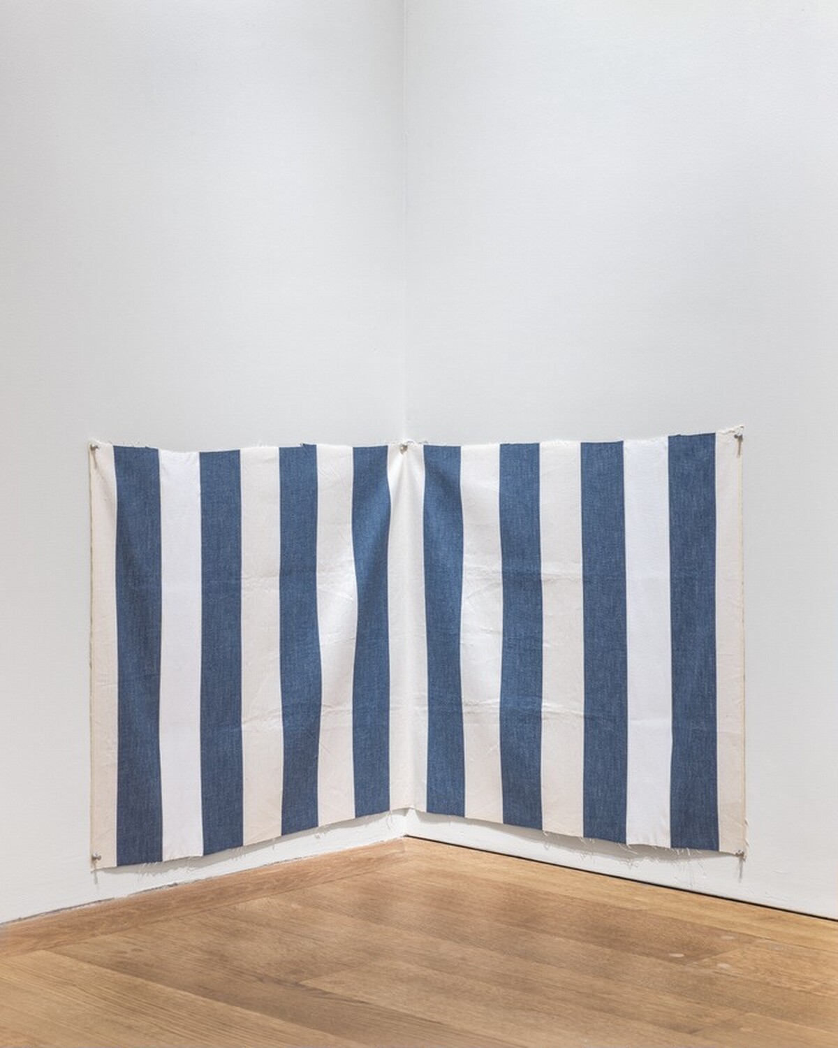 White acrylic paint on white and blue striped cloth by Daniel Buren