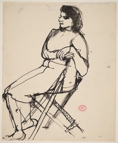 Untitled [side view of a woman seated in a folding chair]