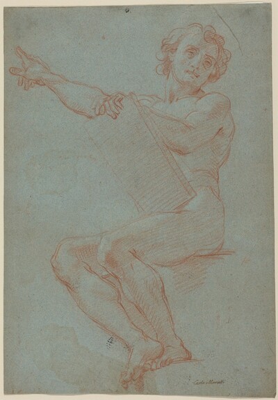A Seated Man Holding a Tablet