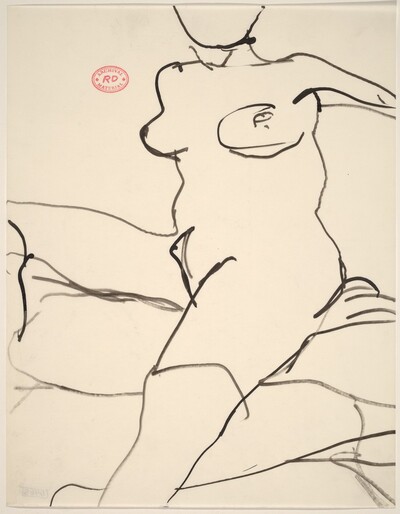 Untitled [female nude seated on cushions]